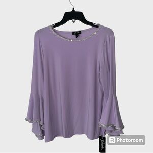 Beautiful women’s top accented with silver sequins   Size medium.